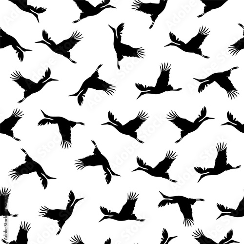 Seamless pattern - stork solhouettes on white