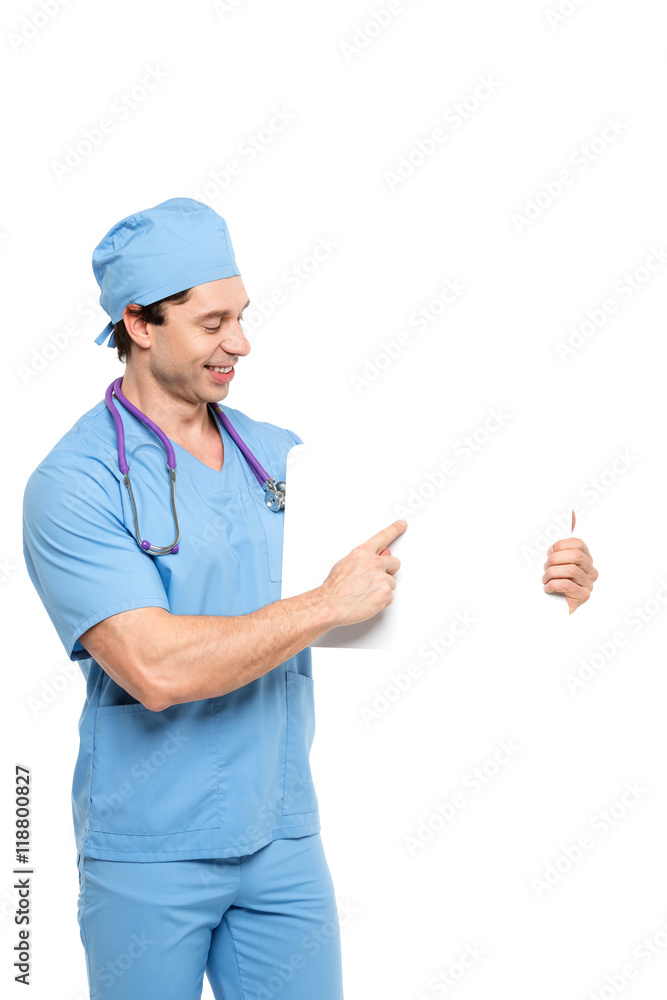 Confident medical doctor / male nurse holding a sign for your text on white background. Confident medical doctor / male nurse holding a sign for your text on white background.