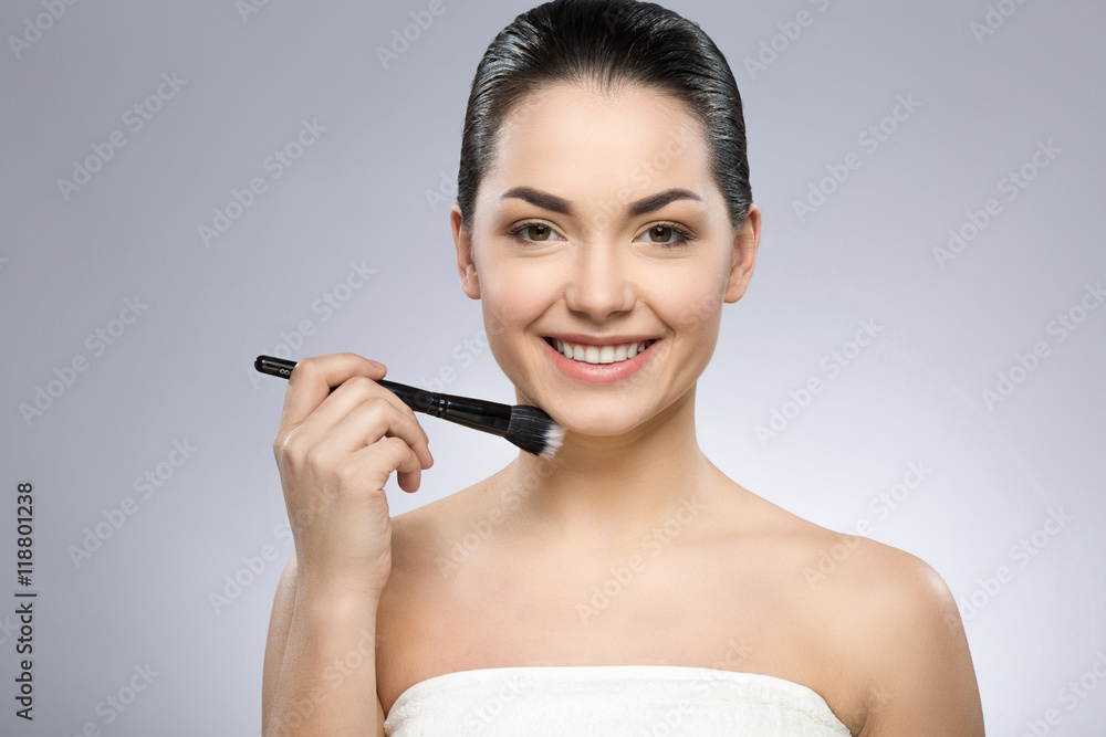 Cute girl holding make up brush