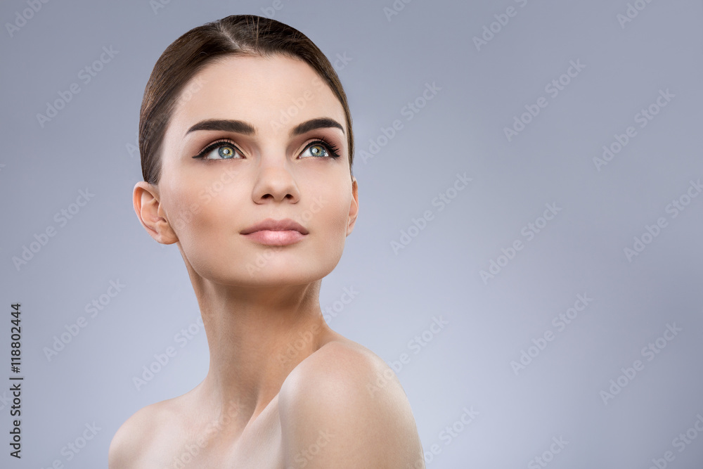 Gorgeous make up model at gray background Gorgeous make up model at gray background
