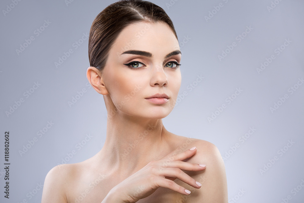 Gorgeous make up model at gray background Gorgeous make up model at gray background