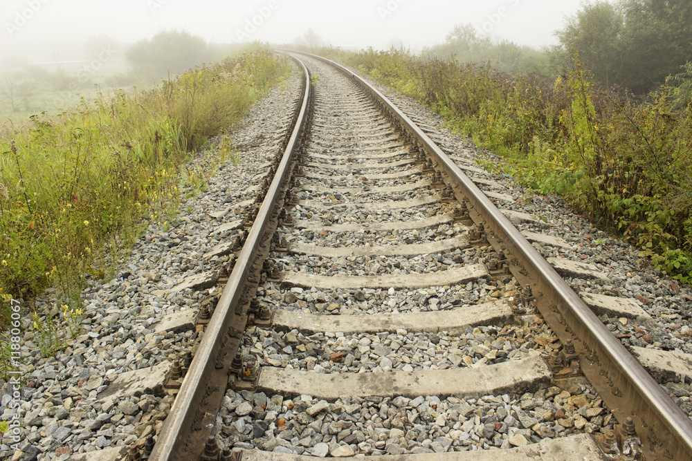 Empty railroad track going into a fog. Perspective view. Empty railroad track going into a fog. Perspective view.