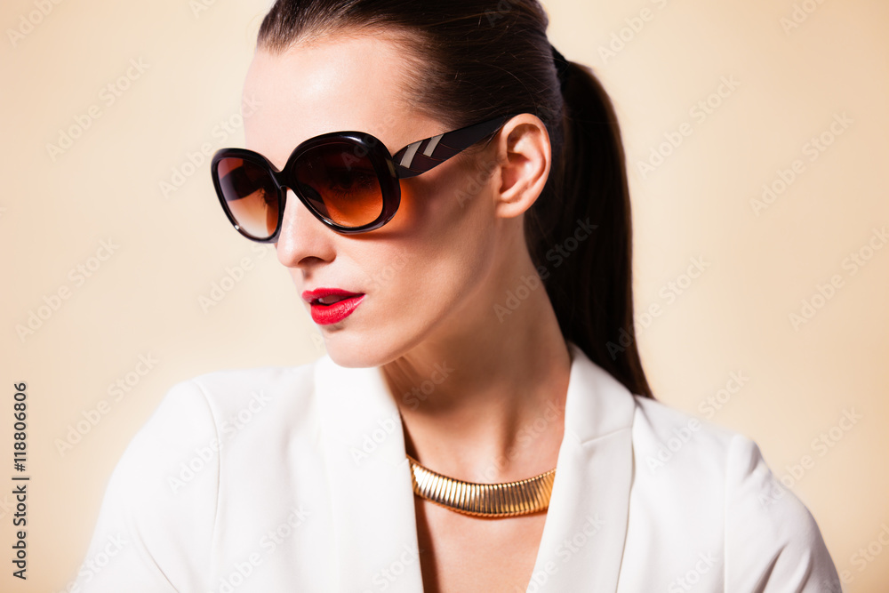 Female fashion portrait wearing sunglasses. Female fashion portrait wearing sunglasses.