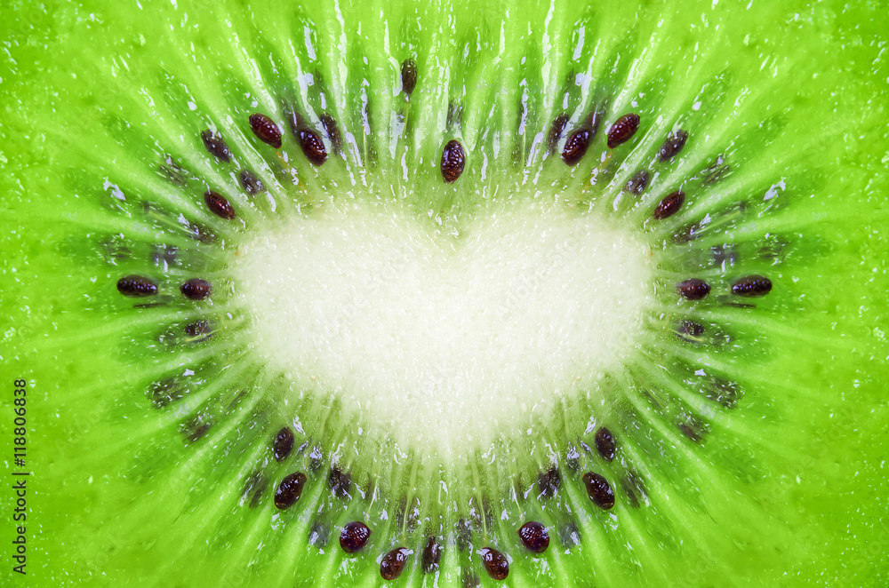 Close up of kiwi fruit texture background with heart shape Close up of kiwi fruit texture background with heart shape