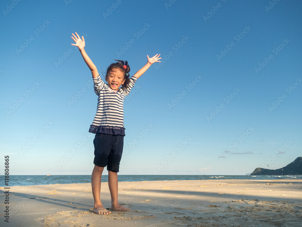 Little asian girl feeling relax on the beach Little asian girl feeling relax on the beach