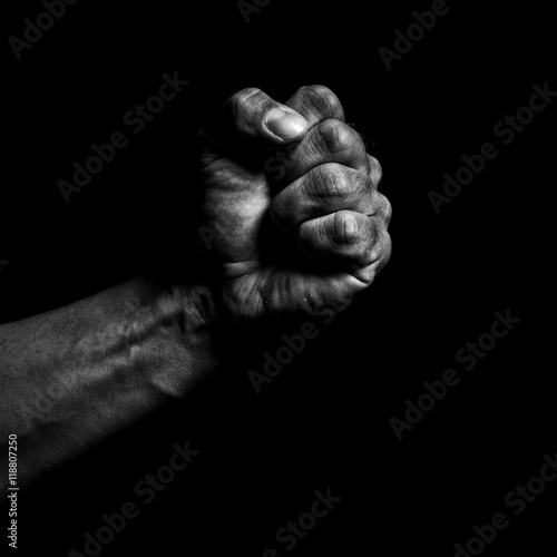 Clenched fist on a black background