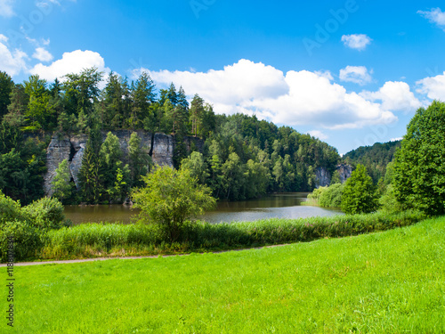 Beautiful lake and sandstone towers in Bohemian Paradise, or Cesky Raj, on sunny summer day, Czech Republic