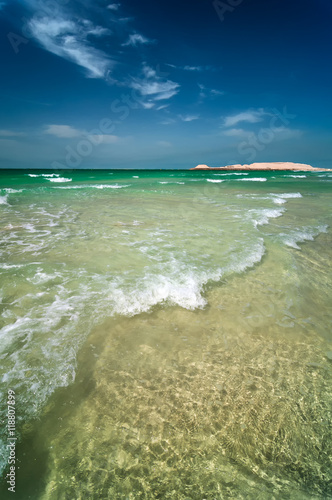 Beautiful sunny Jumeirah beach in Dubai with crystal clear sea water and amazing blue sky  Dubai  United Arab Emirates.