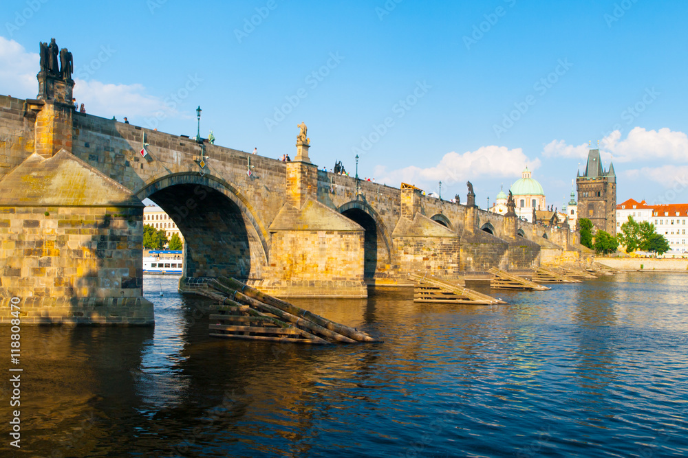 Charles Bridge, aka Karluv most, and Vltava river in Prague city centre on sunny summer day with blue sky, Czech Republic