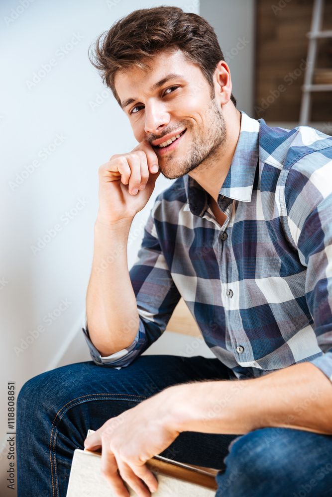 Close up portrait of a young handsome man sitting Close up portrait of a young handsome man sitting