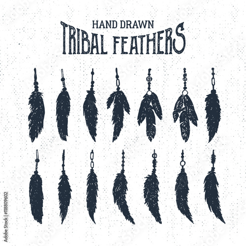 Hand drawn tribal style feathers set. Vector illustration.