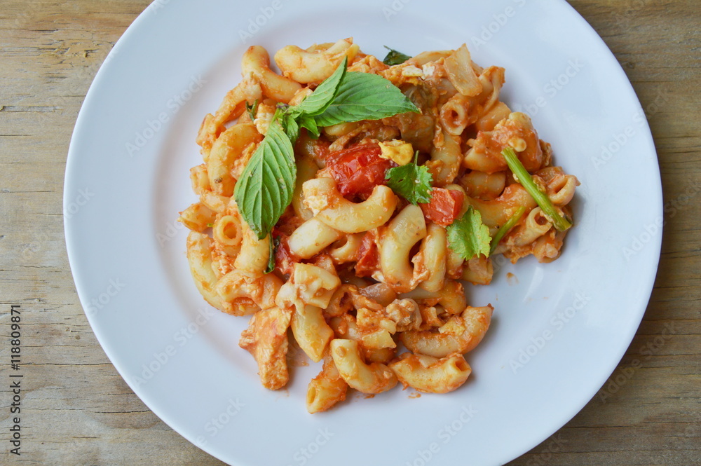 stir fried macaroni and egg with pork in ketchup on plate