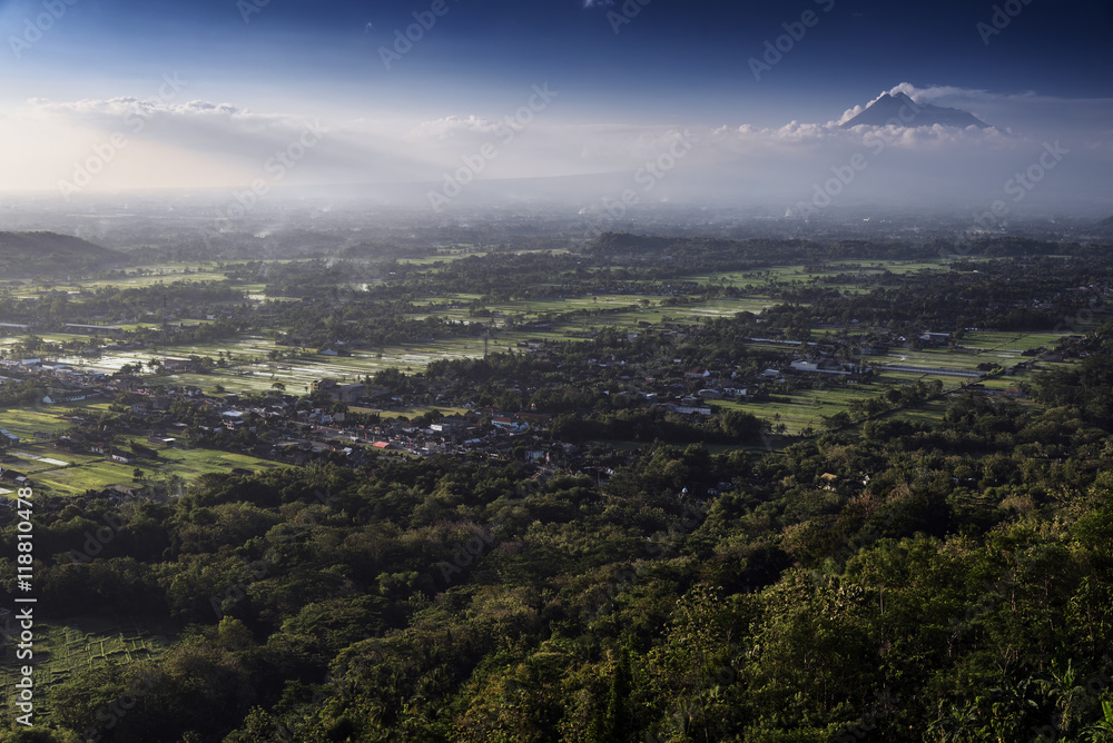 Fototapeta premium View of Jogjakarta with Merapi volcano, Jawa, Indonesia