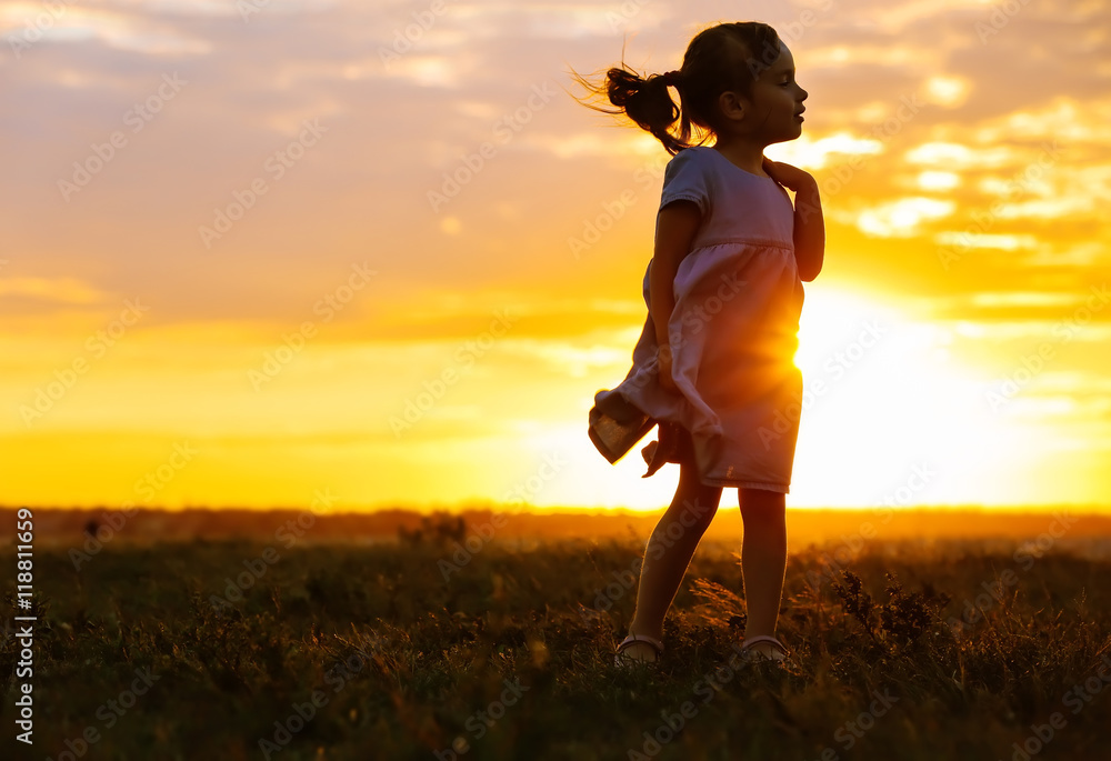 Cute girl silhouette on sunset background Stock Photo | Adobe Stock