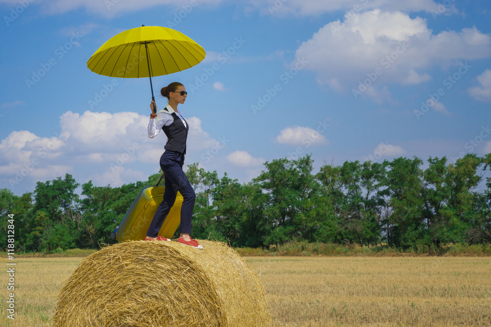 Unusual journey with a suitcase on top of the haystack Unusual journey with a suitcase on top of the haystack