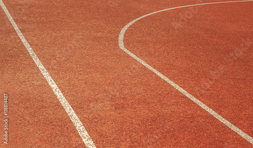 Part of a tennis court which shows a straight line and the curve