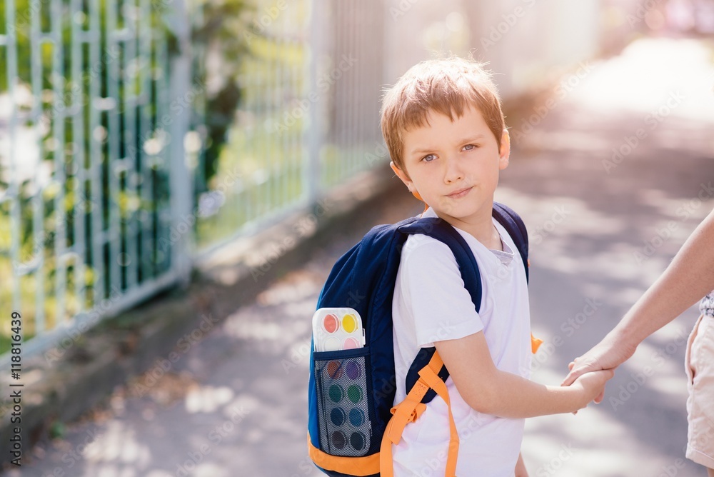 7 years old boy going to school with his mother Stock Photo | Adobe Stock