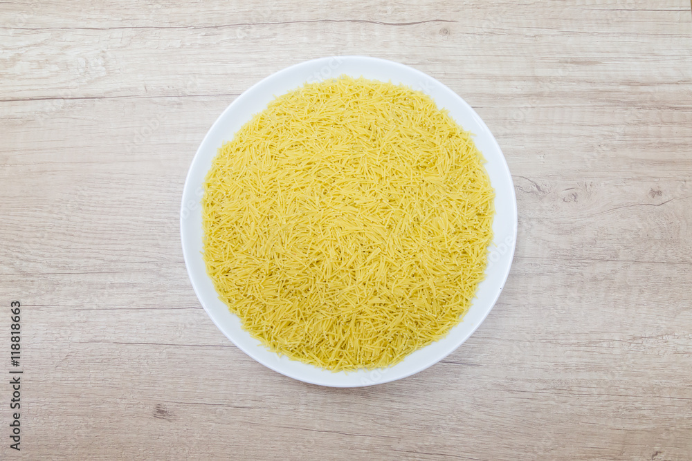 white bowl of noodles on a kitchen towel
white bowl of noodles on a kitchen towel
