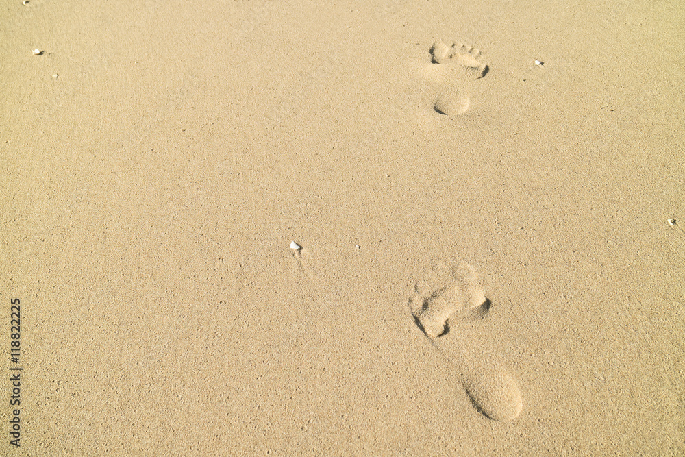 Footprints in wet sand of beach backgorund Footprints in wet sand of beach backgorund