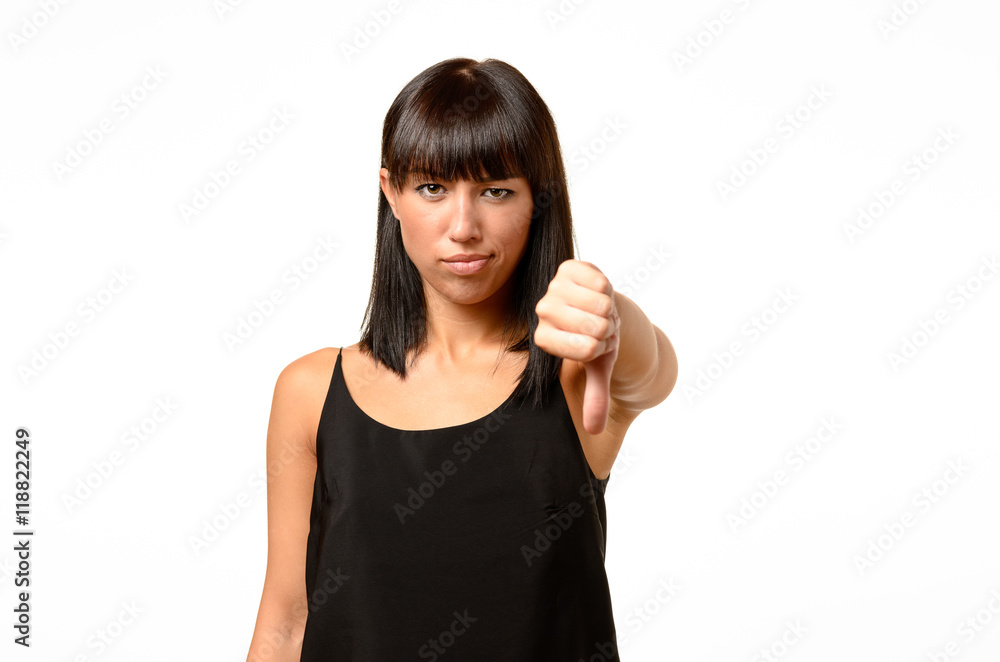 Rebellious negative woman giving a thumbs down Rebellious negative woman giving a thumbs down