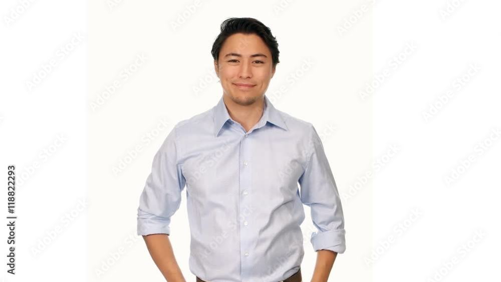 An attractive relaxed man wearing a blue shirt, looking at camera with a big smile. White background. An attractive relaxed man wearing a blue shirt, looking at camera with a big smile. White background.