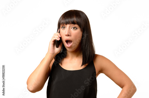 Young woman receiving bad news on her mobile