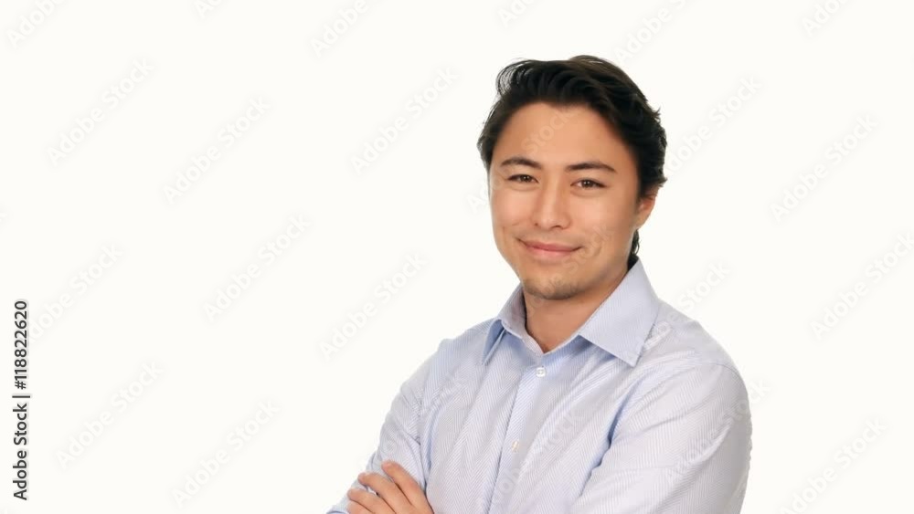 An attractive relaxed man wearing a blue shirt, looking at camera with a big smile. White background. An attractive relaxed man wearing a blue shirt, looking at camera with a big smile. White background.