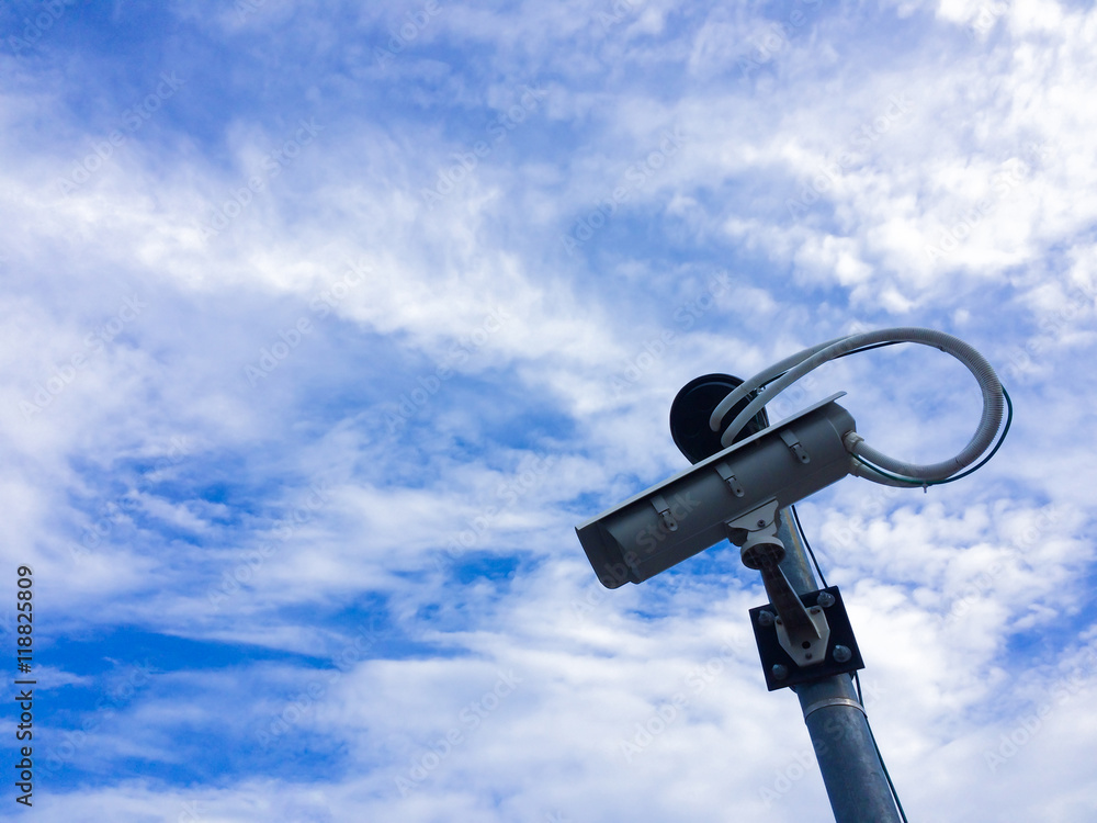 CCTV camera with cloud and blue sky. CCTV camera with cloud and blue sky.