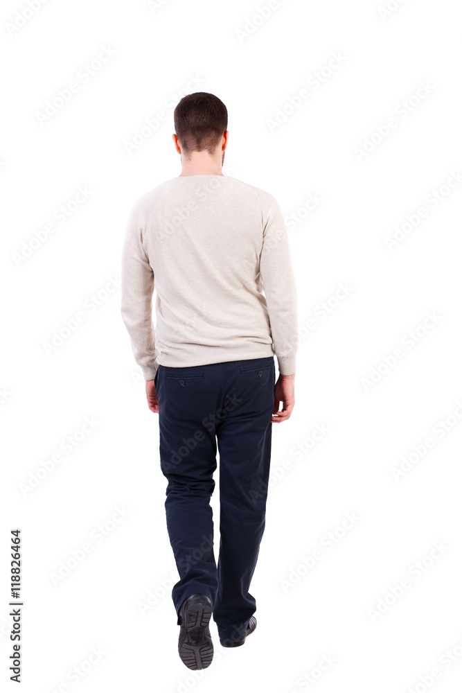 back view of Business man looks. Rear view people collection. backside view of person. Isolated over white background. The bearded man in a white warm sweater is slowly moving forward. back view of Business man looks. Rear view people collection. backside view of person. Isolated over white background. The bearded man in a white warm sweater is slowly moving forward.