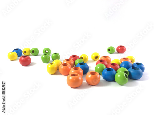 Colorful wooden beads isolated on white.