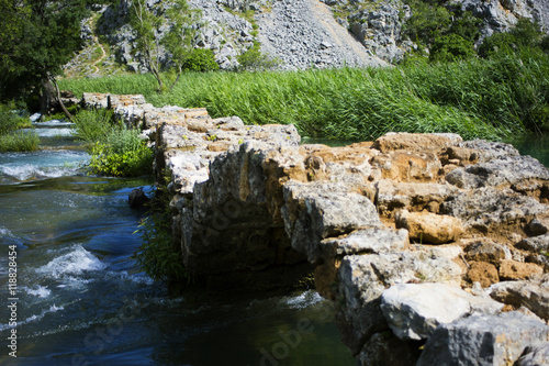 Old bridge on Krupa river, Croatia photo