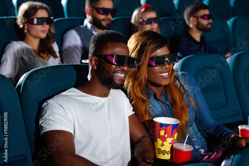 Young African couple at the cinema