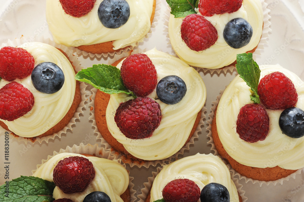 cakes with raspberries and blueberries on a plate cakes with raspberries and blueberries on a plate