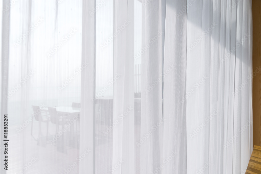view seascape looking pass Translucent white fabric curtains and view seascape looking pass Translucent white fabric curtains and