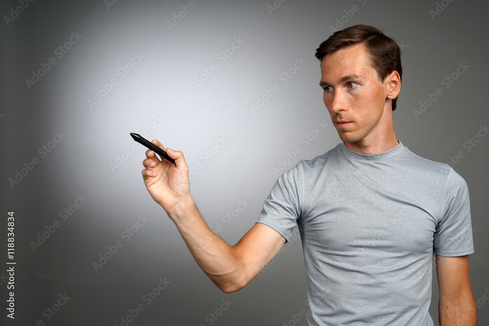 Man writing something with marker on glass board. Man writing something with marker on glass board.