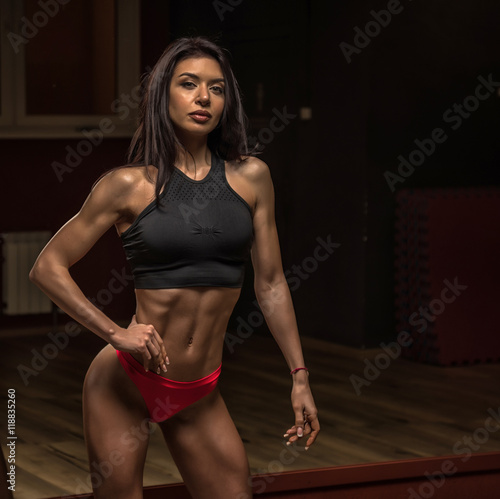 Beautiful sexy girl posing in the gym