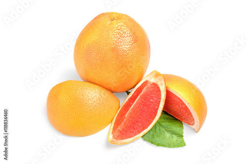 Grapefruit with wedges on white background