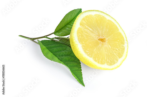 Lemon slice with green leafs isolated on white