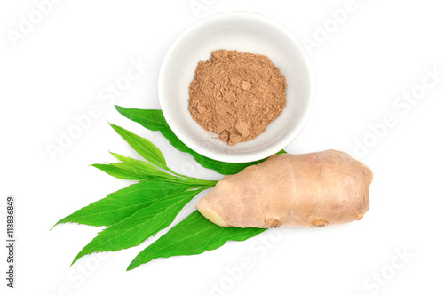 Powdered ginger in bowl and root isolated on a white