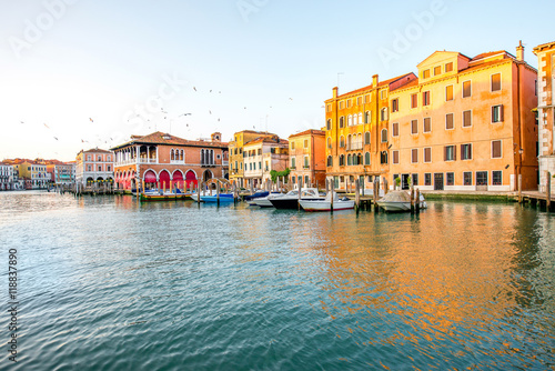 Venice cityscape view on Grand canal with colorful buildings and boats at the sunrise © rh2010