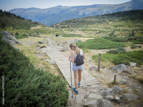 Obraz na płótnie woman hiking in the natural park of Guadarrama w salonie