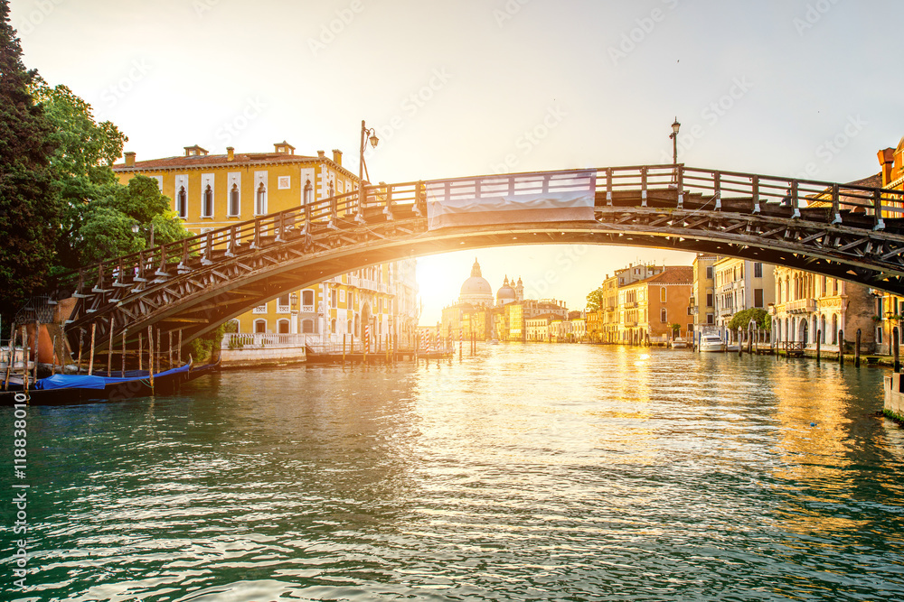 View on Accademic wooden bridge on Gran canal at the sunrise in Venice