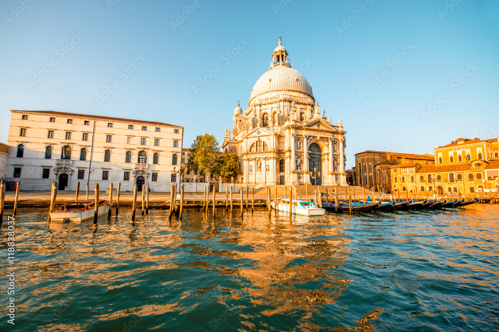Beautiful waterfront with gothic buildings and Santa Maria basilica on the Grand canal at the morning in Venice