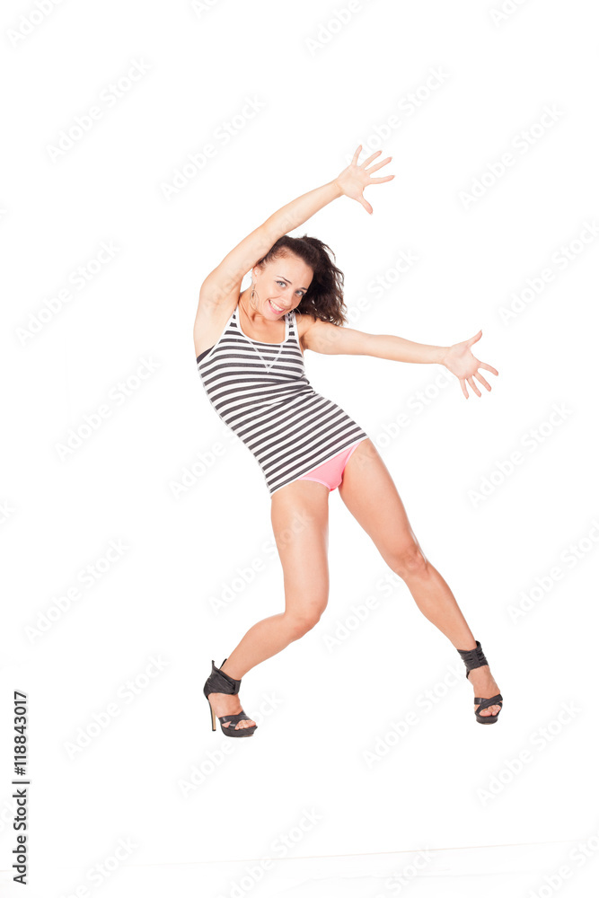 Go Go dancer in military clothes isolated on white shows sports figure. beautiful model in a sport dancing suit Go Go dancer in military clothes isolated on white shows sports figure. beautiful model in a sport dancing suit