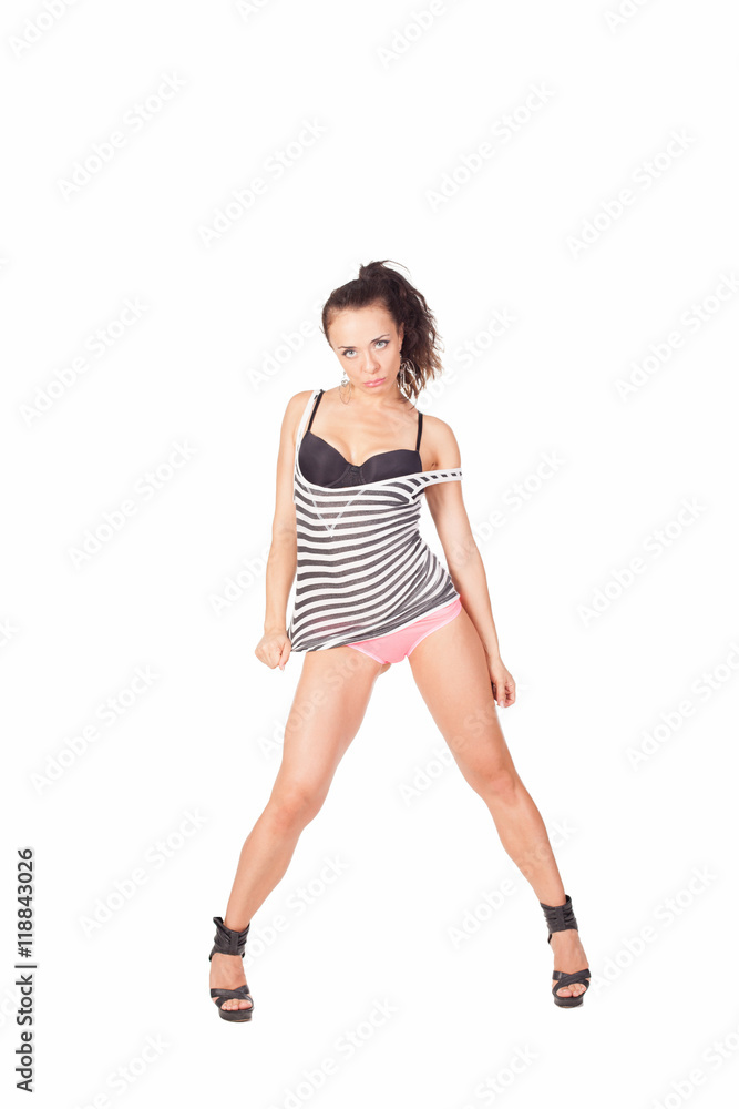 Go Go dancer in military clothes isolated on white shows sports figure. beautiful model in a sport dancing suit Go Go dancer in military clothes isolated on white shows sports figure. beautiful model in a sport dancing suit