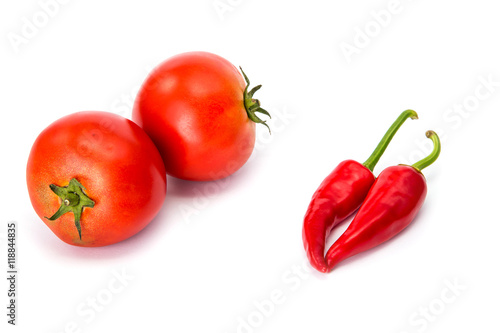  tomatoes and hot peppers white background