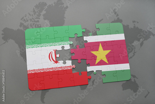 puzzle with the national flag of iran and suriname on a world map background.