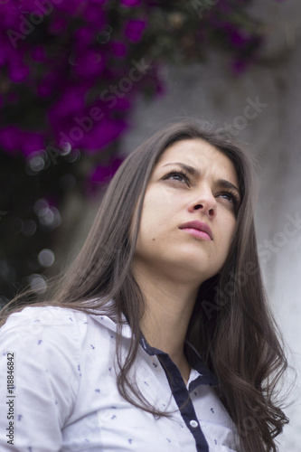 Young woman looking up