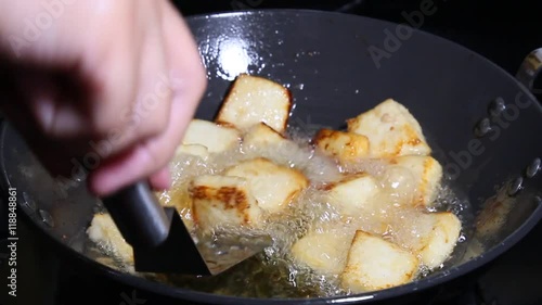 Frying Paneer cheese cubes in oil
