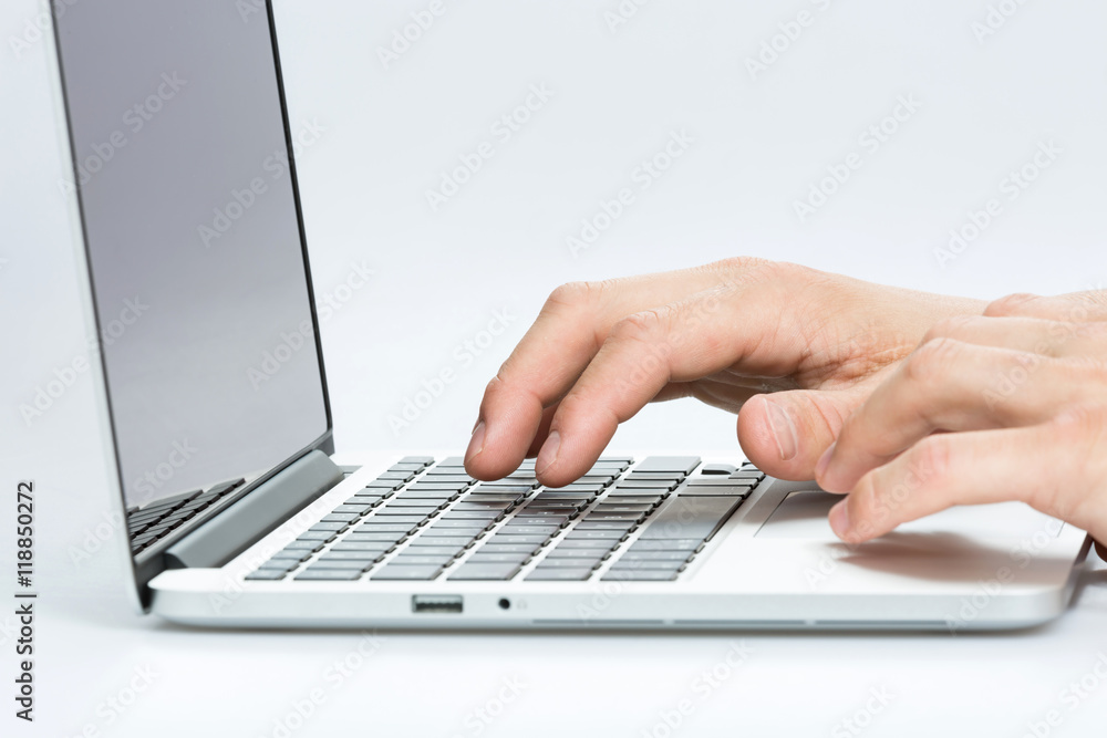Male office worker working at home. Hands typing on a computer keyboard. Male office worker working at home. Hands typing on a computer keyboard.
